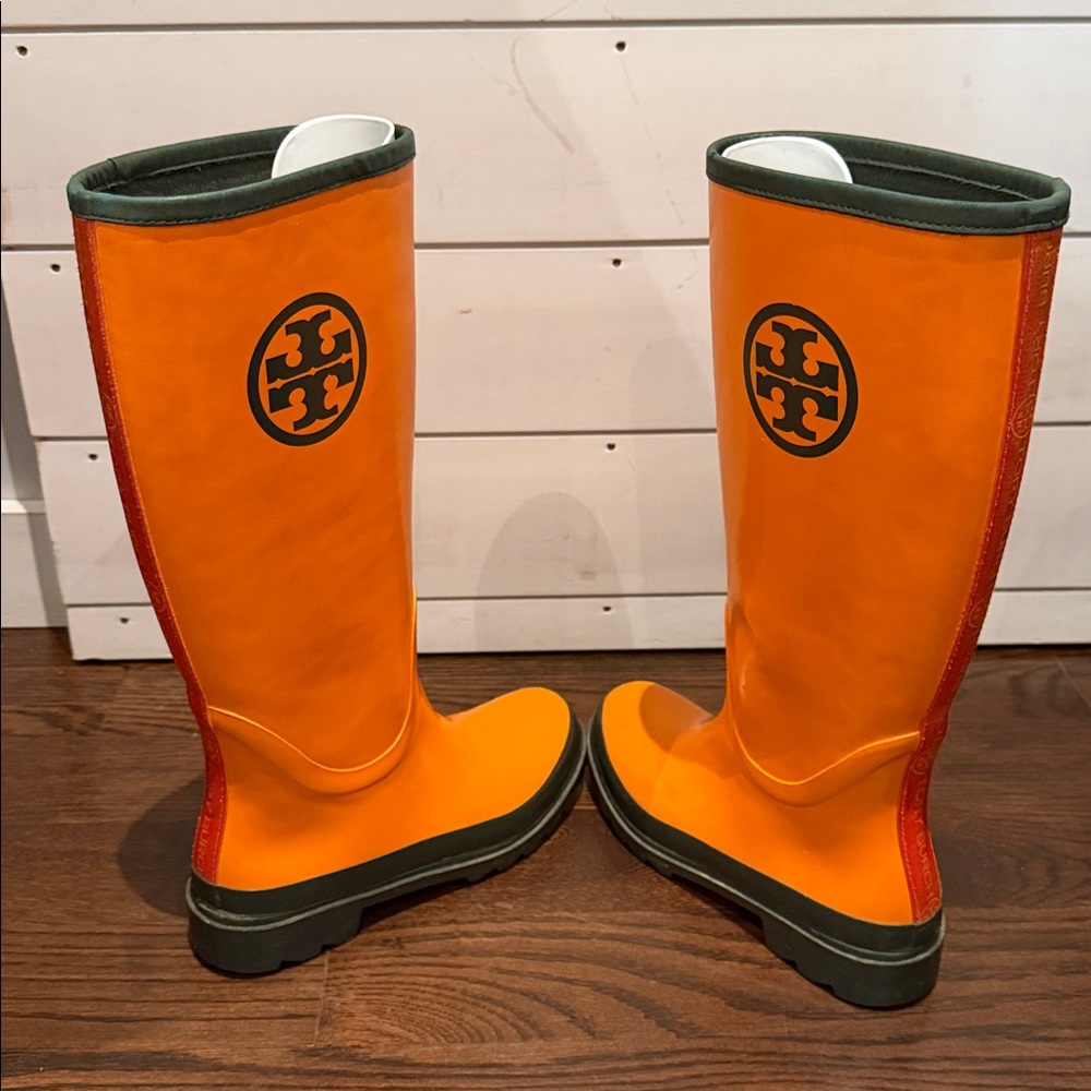Authentic Tory Burch rain boots, orange with green logo. Size 6.